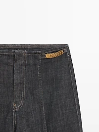 High-waist wide-leg jeans with chains