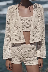 GILET EN MAILLE POINTELLE À FLEURS