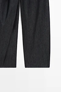High-waist pants with crossover detail