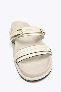 FLAT BUCKLED SANDALS