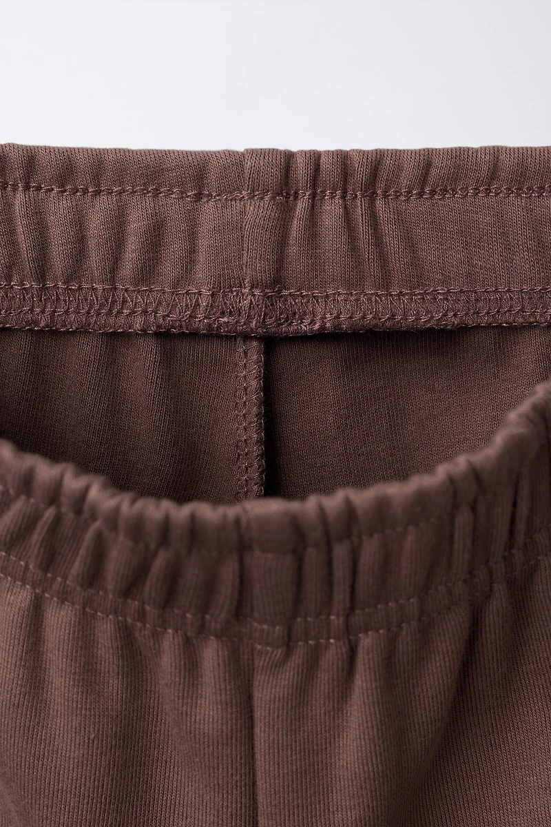 WIDE LEG RAISED TEXT PLUSH PANTS