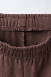 WIDE LEG RAISED TEXT PLUSH PANTS