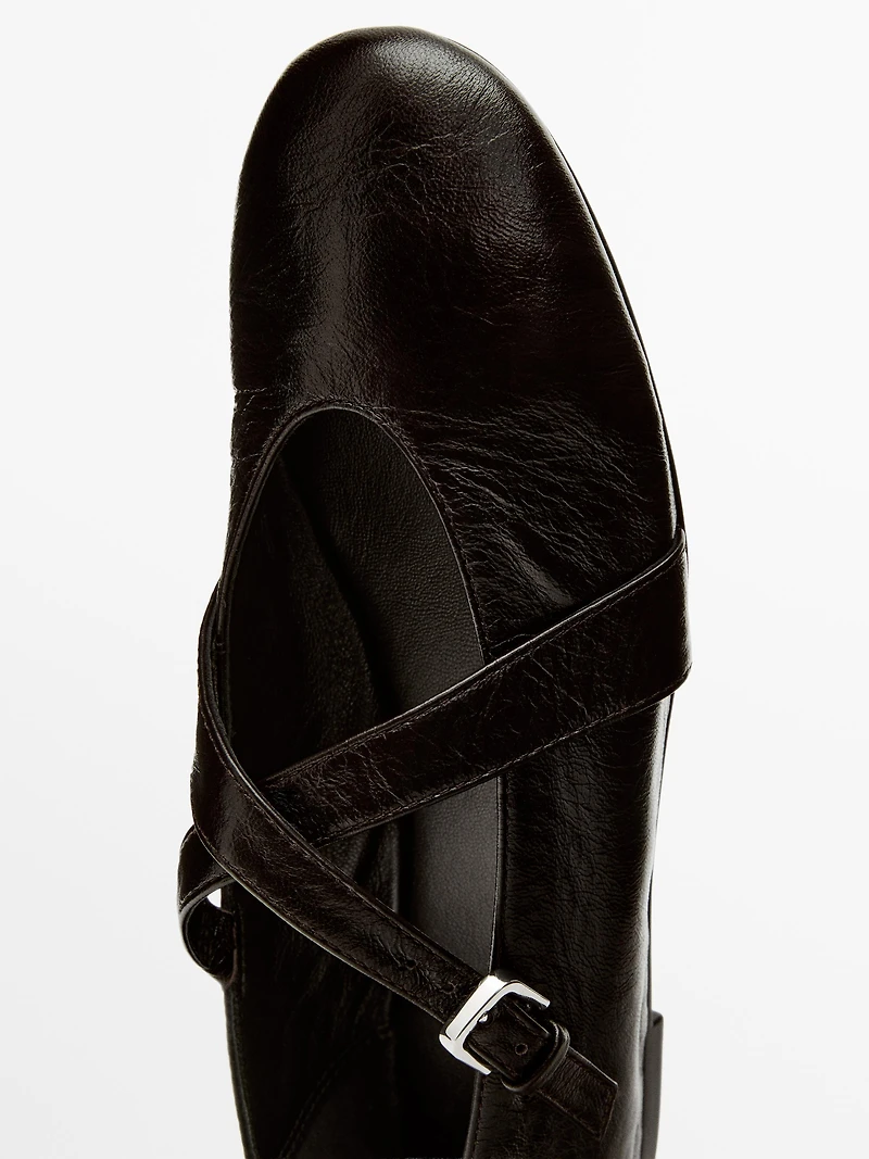Ballet flats with criss-cross straps and buckle