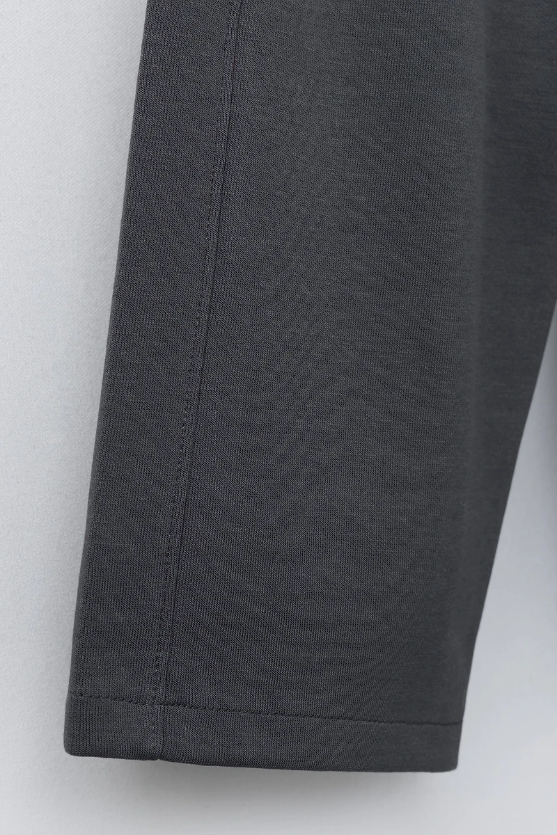 WIDE LEG INTERLOCK RAISED TEXT PANTS
