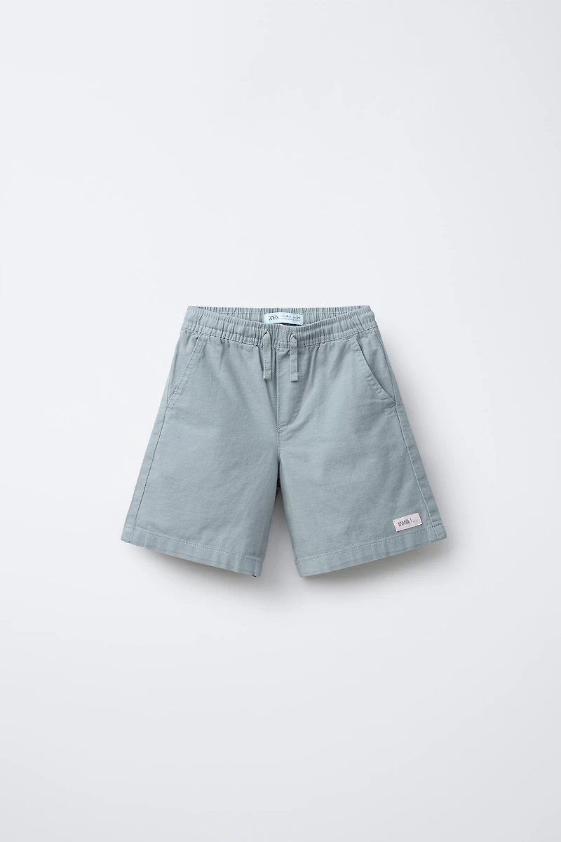 BERMUDA EN COTON COUPE AMPLE ÉTIQUETTE
