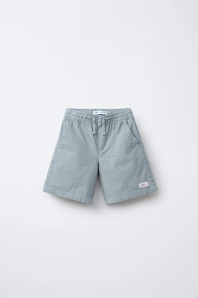 BERMUDA EN COTON COUPE AMPLE ÉTIQUETTE