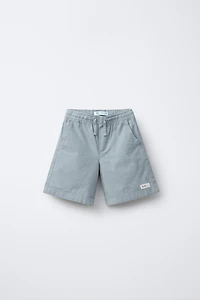 BERMUDA EN COTON COUPE AMPLE ÉTIQUETTE