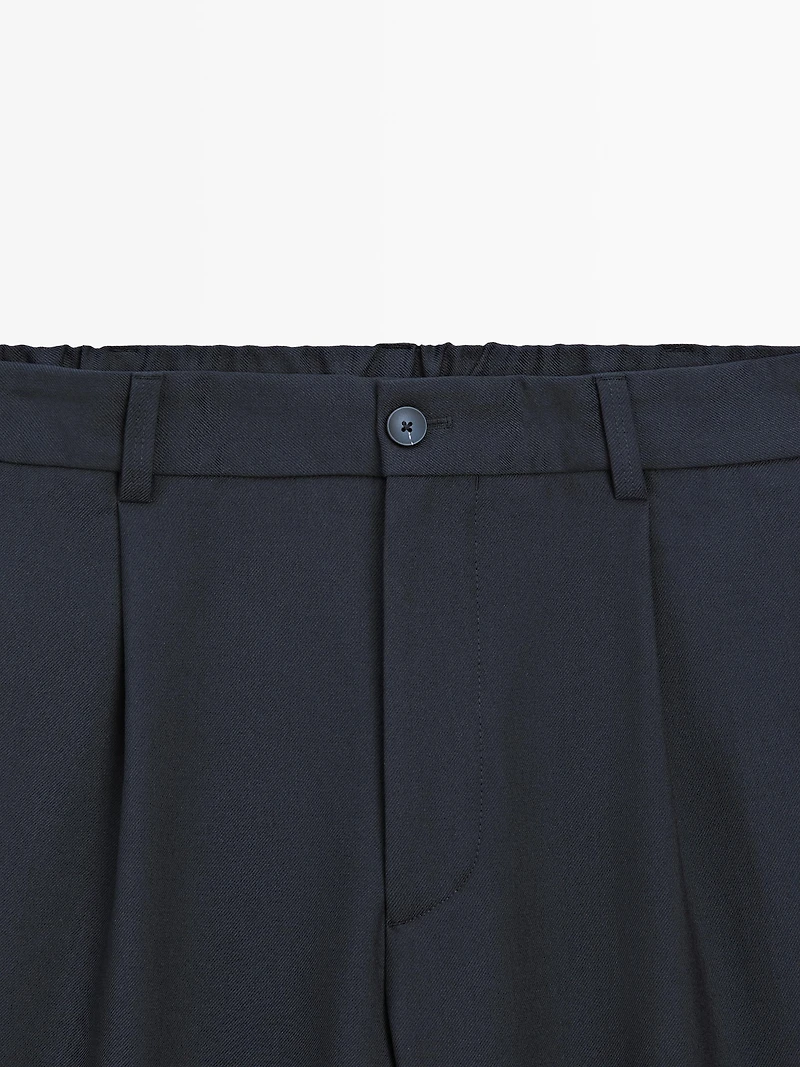 Pantalon relaxed fit à pinces en laine mélangée