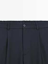 Pantalon relaxed fit à pinces en laine mélangée