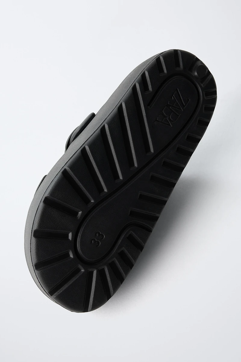 RUBBERIZED BUCKLED SANDALS