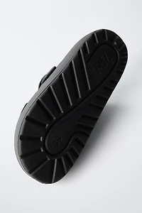 RUBBERIZED BUCKLED SANDALS