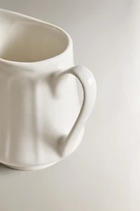 PORCELAIN CREAM PITCHER WITH RAISED PATTERN