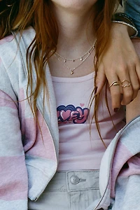 SWEAT ZIPPÉ À RAYURES ET PIÈCE