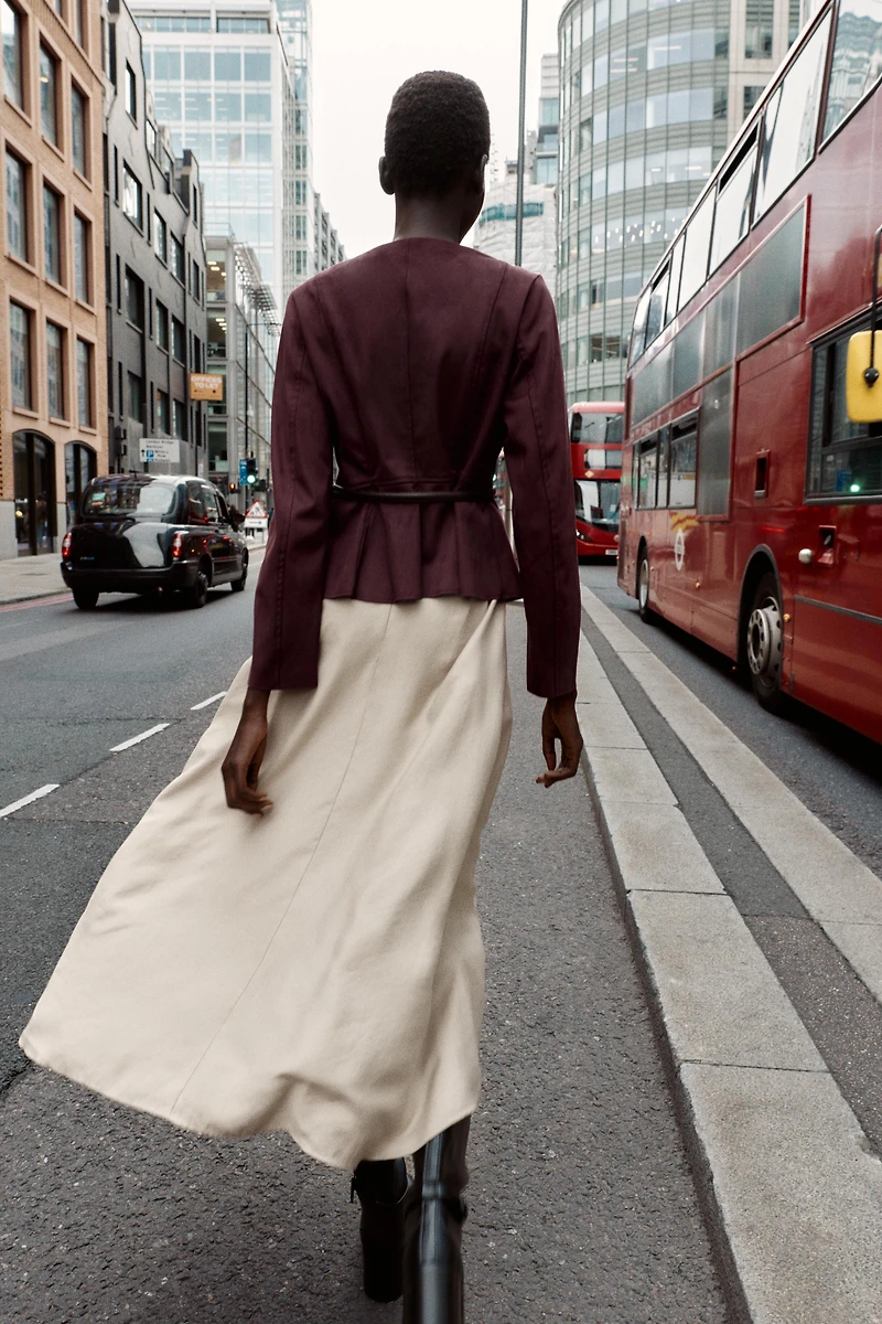 VESTE PEPLUM EFFET DAIM CEINTURÉE