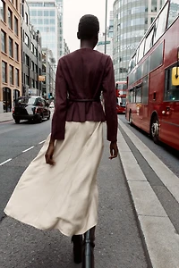VESTE PEPLUM EFFET DAIM CEINTURÉE