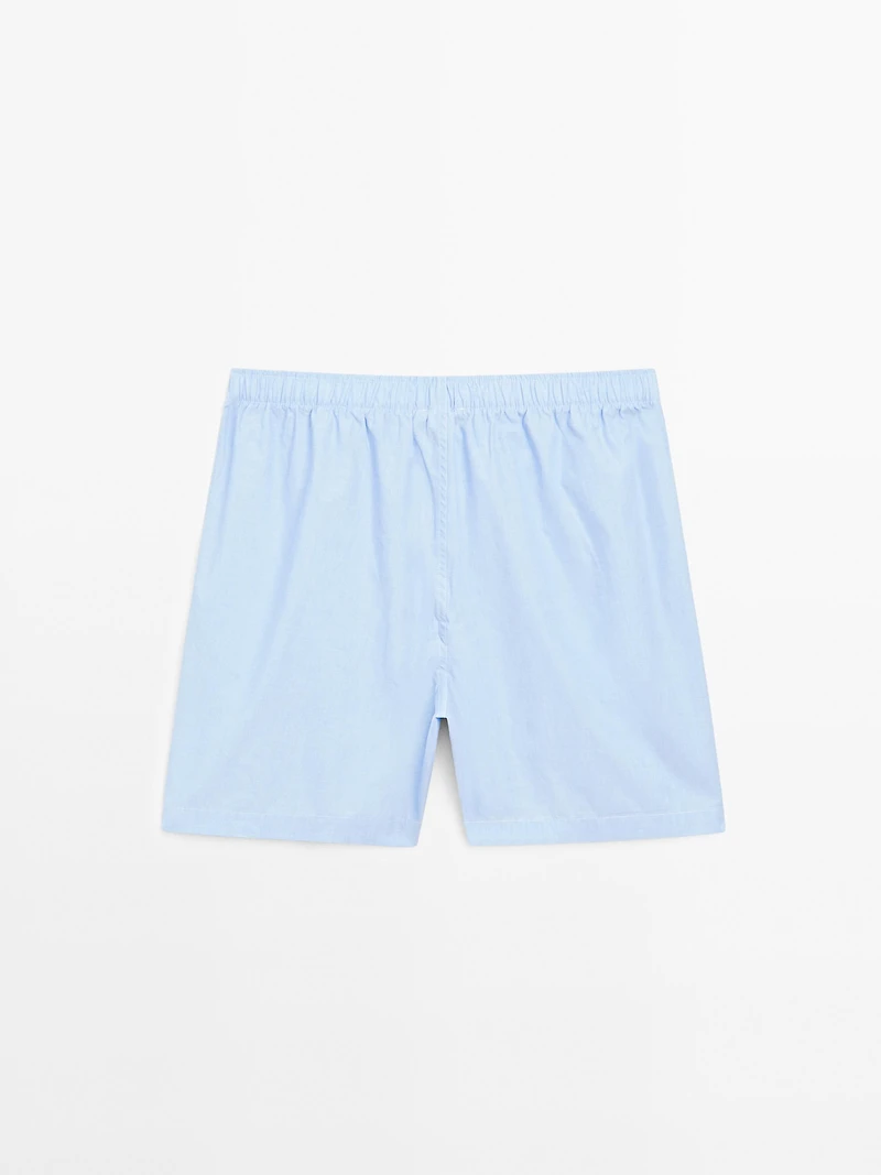 Short sleeve pyjama top and striped trousers