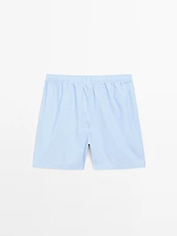 Short sleeve pyjama top and striped trousers