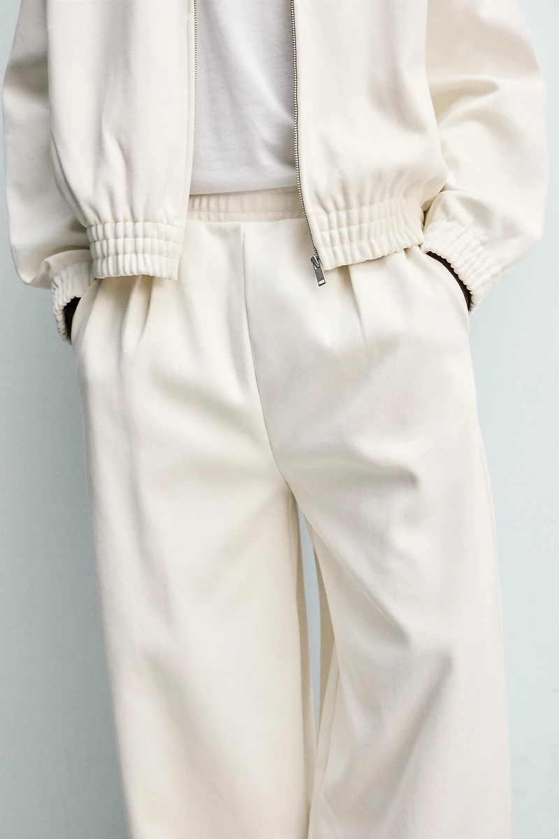 PLEATED WIDE FIT JOGGER PANTS