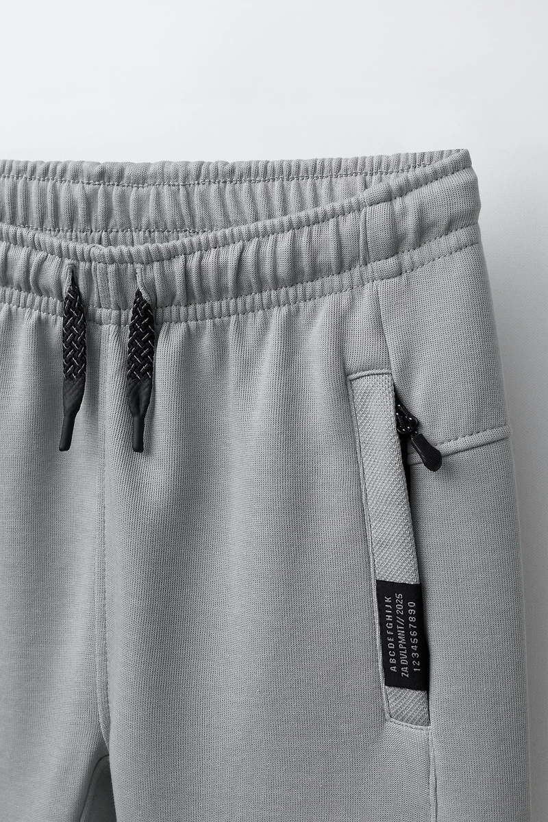 PANTALON EN MOLLETON INTERLOCK ET PIQUÉ