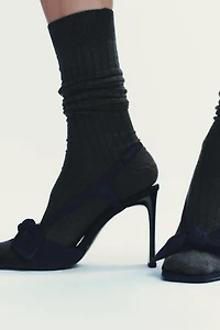 SUEDE BOW HEELED SANDALS