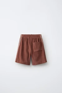 BERMUDA EN TISSU ÉPONGE PUKAS SURF