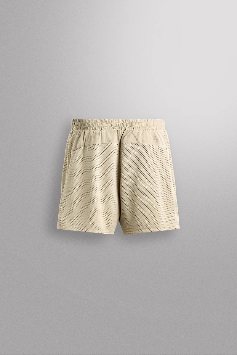 COMBINED PERFORATED SHORTS