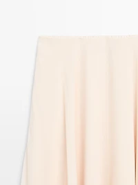 Flowing asymmetric midi skirt