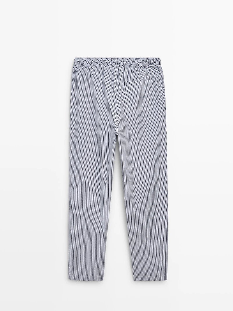 Short sleeve pyjama top and striped trousers