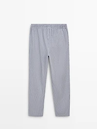 Short sleeve pyjama top and striped trousers