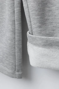 PANTALON EN MOLLETON À JAMBES LARGES