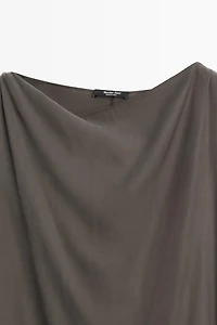 Asymmetric flowing cape top