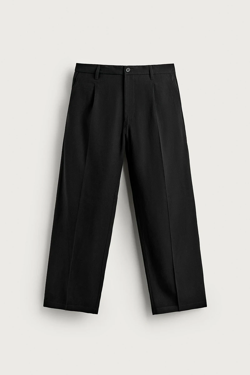 FLOWY RELAXED FIT PLEATED PANTS