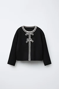 GILET EN MAILLE À NŒUDS