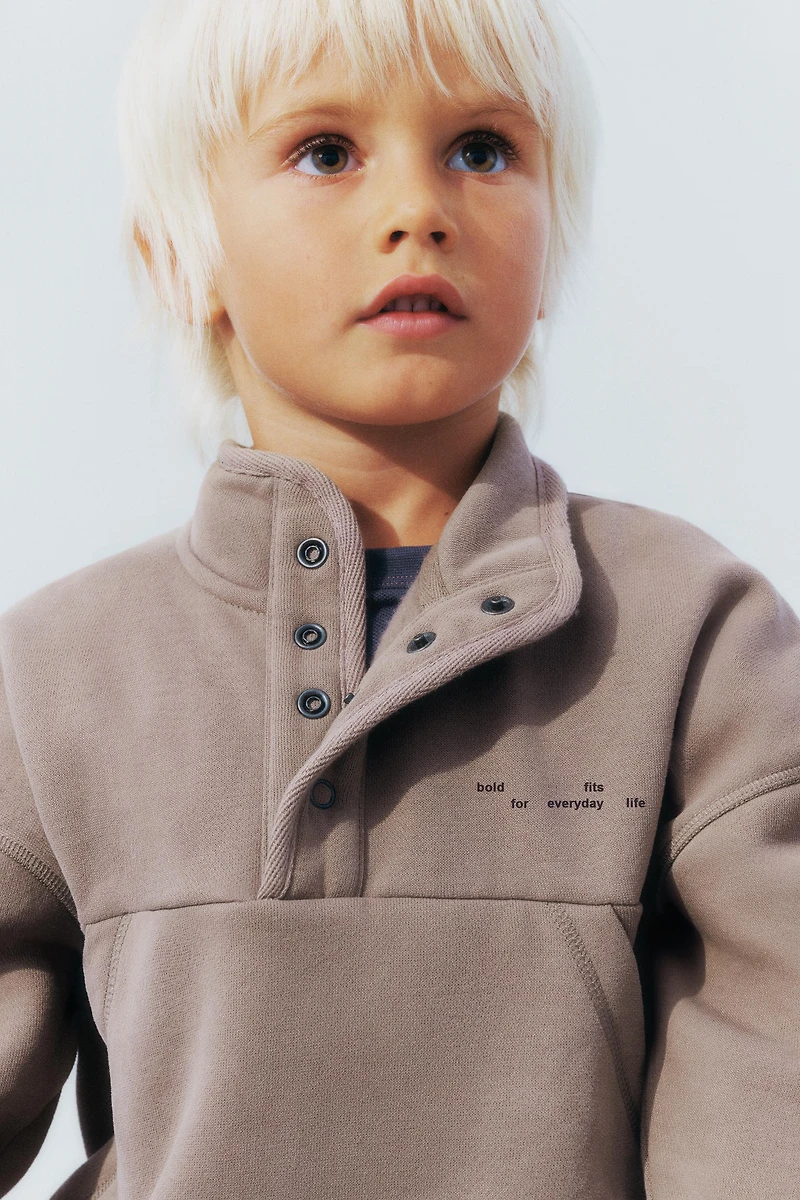 RAISED TEXT AND LOGO SWEATSHIRT