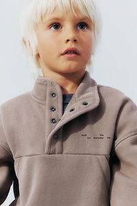 RAISED TEXT AND LOGO SWEATSHIRT