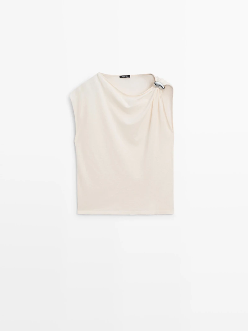 Asymmetric top with shoulder appliqué