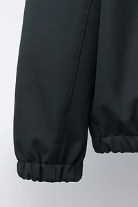HOODED TECHNICAL JACKET