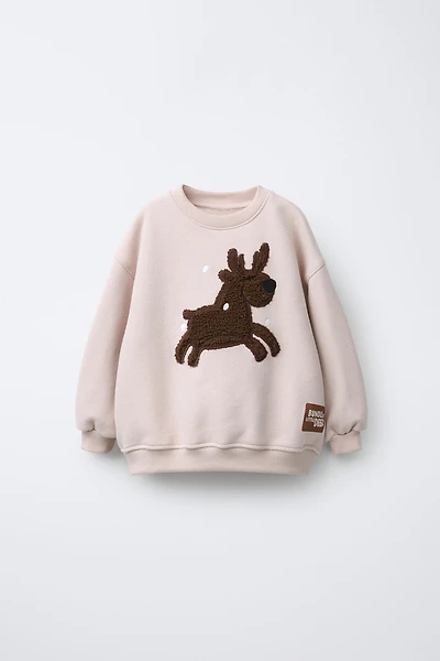 REINDEER FAUX SHEARLING PATCH SWEATSHIRT