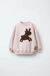 REINDEER FAUX SHEARLING PATCH SWEATSHIRT