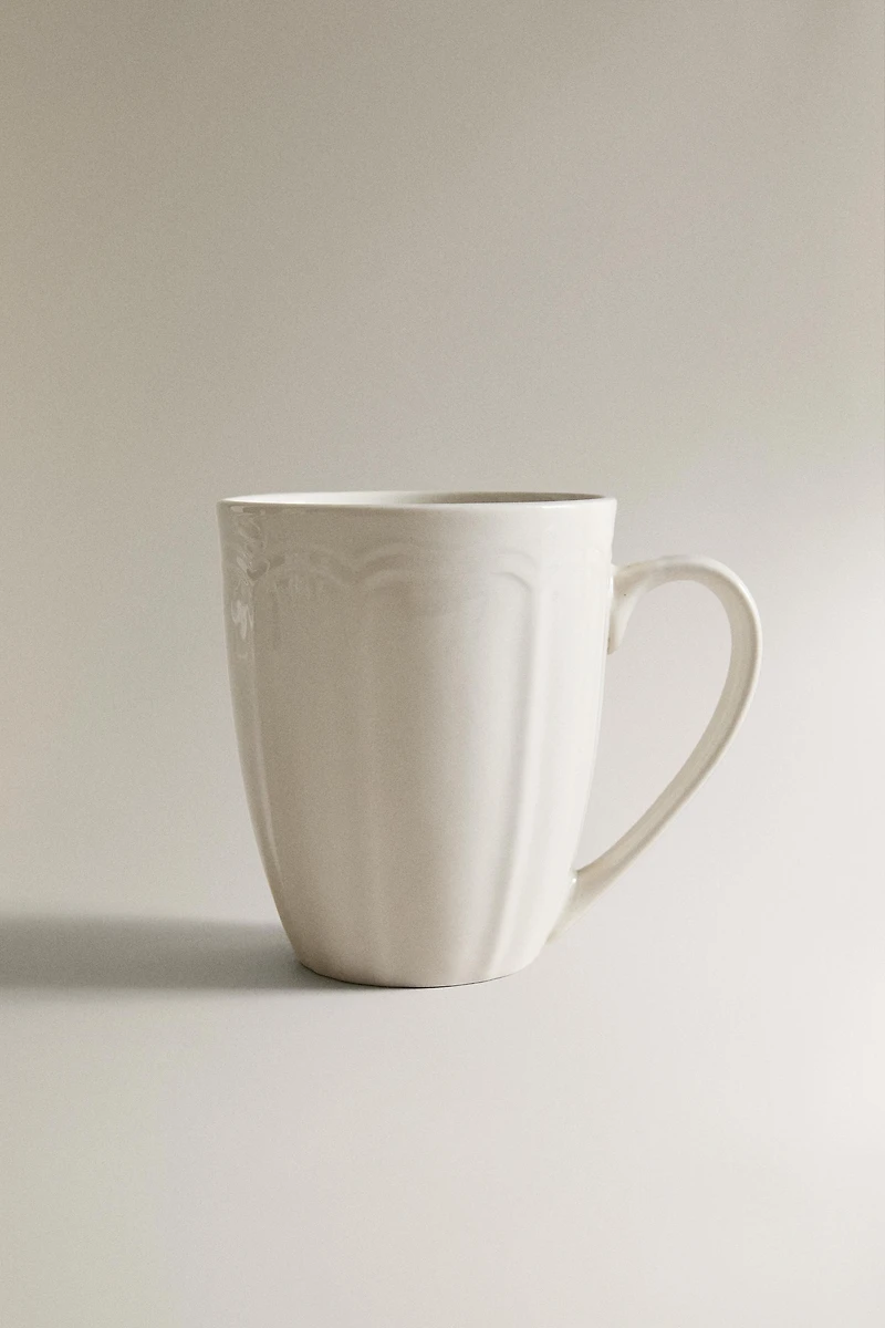 PORCELAIN MUG WITH RAISED DESIGN