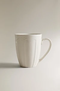 PORCELAIN MUG WITH RAISED DESIGN