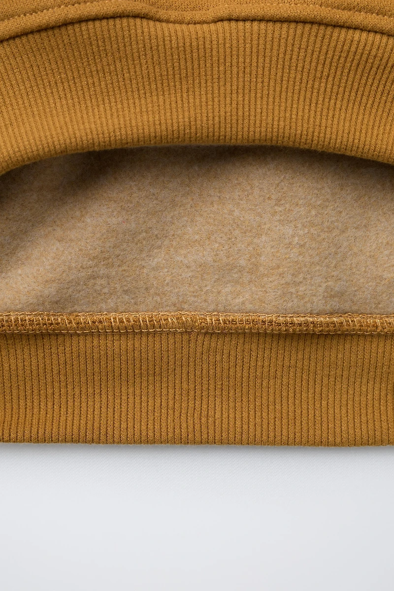 RAISED TEXT HOODIE SWEATSHIRT