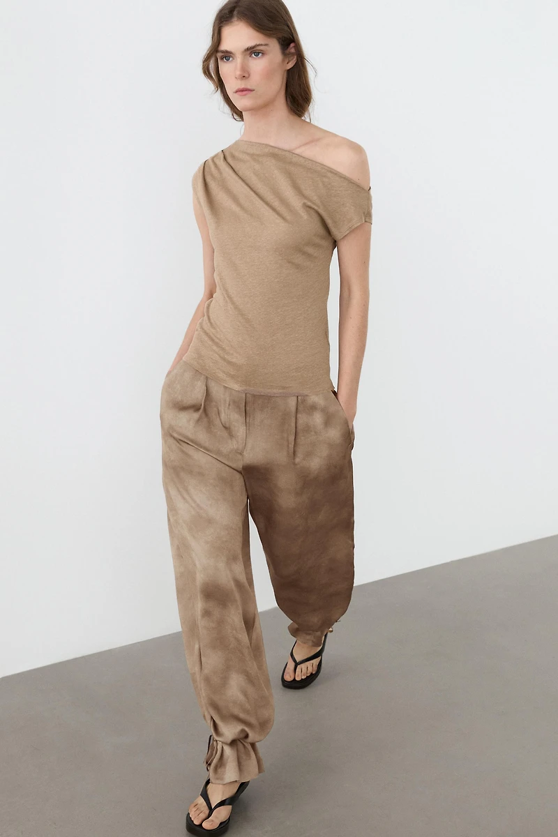 Flowing pants with tie-detail hem