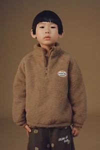 FAUX SHEARLING LABEL SWEATSHIRT