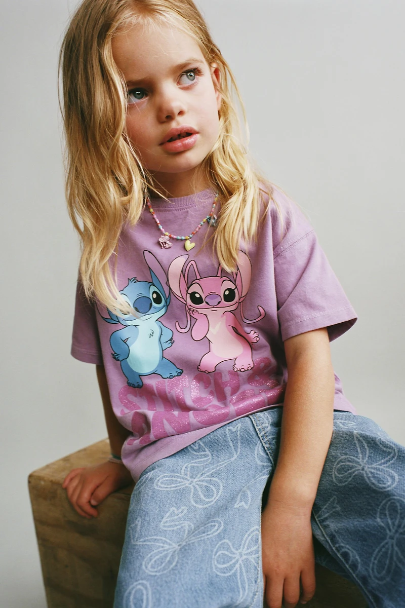 T-SHIRT IMPRIMÉ BRILLANT STITCH & ANGEL © DISNEY