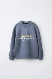 PULL EN MAILLE AVEC INSCRIPTION IMPRIMÉE