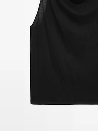 Sleeveless top with draped neckline