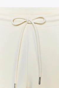 INTERLOCK FLARE PANTS