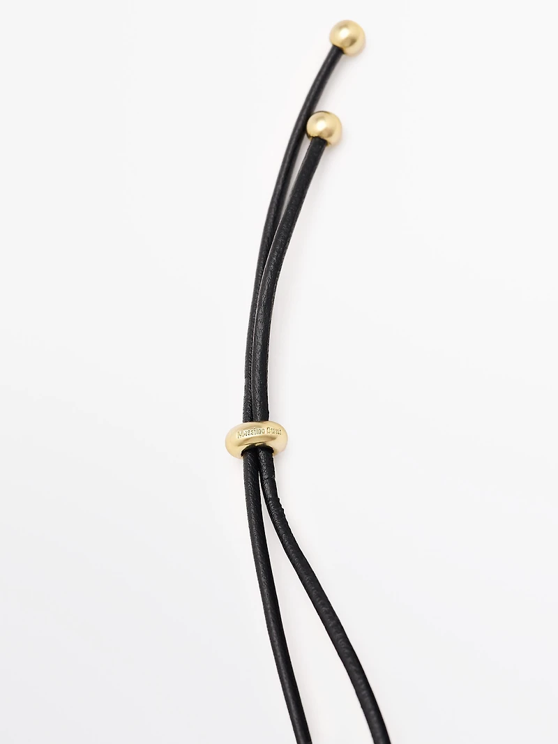 Pendentif pièce dorée
