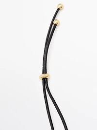 Pendentif pièce dorée
